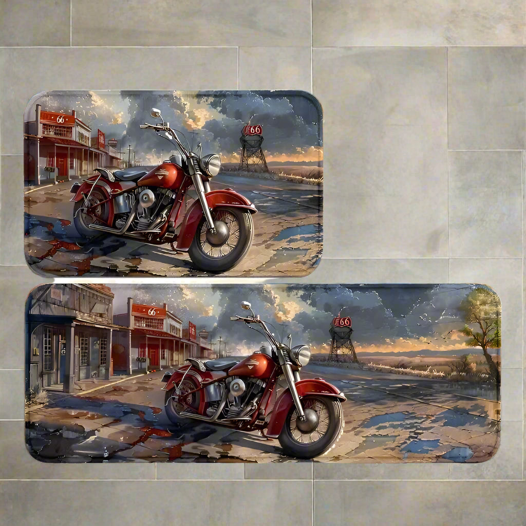 A set of two rectangular floor mats with a motorcycle depicted against a rustic town backdrop, primarily in shades of red and blue.
