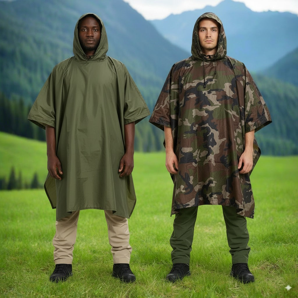 Two people wearing green and camouflage rain ponchos in a mountainous landscape.