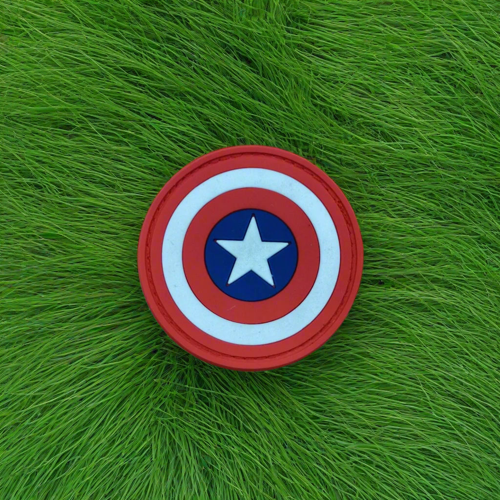 Captain America shield patch on green grass