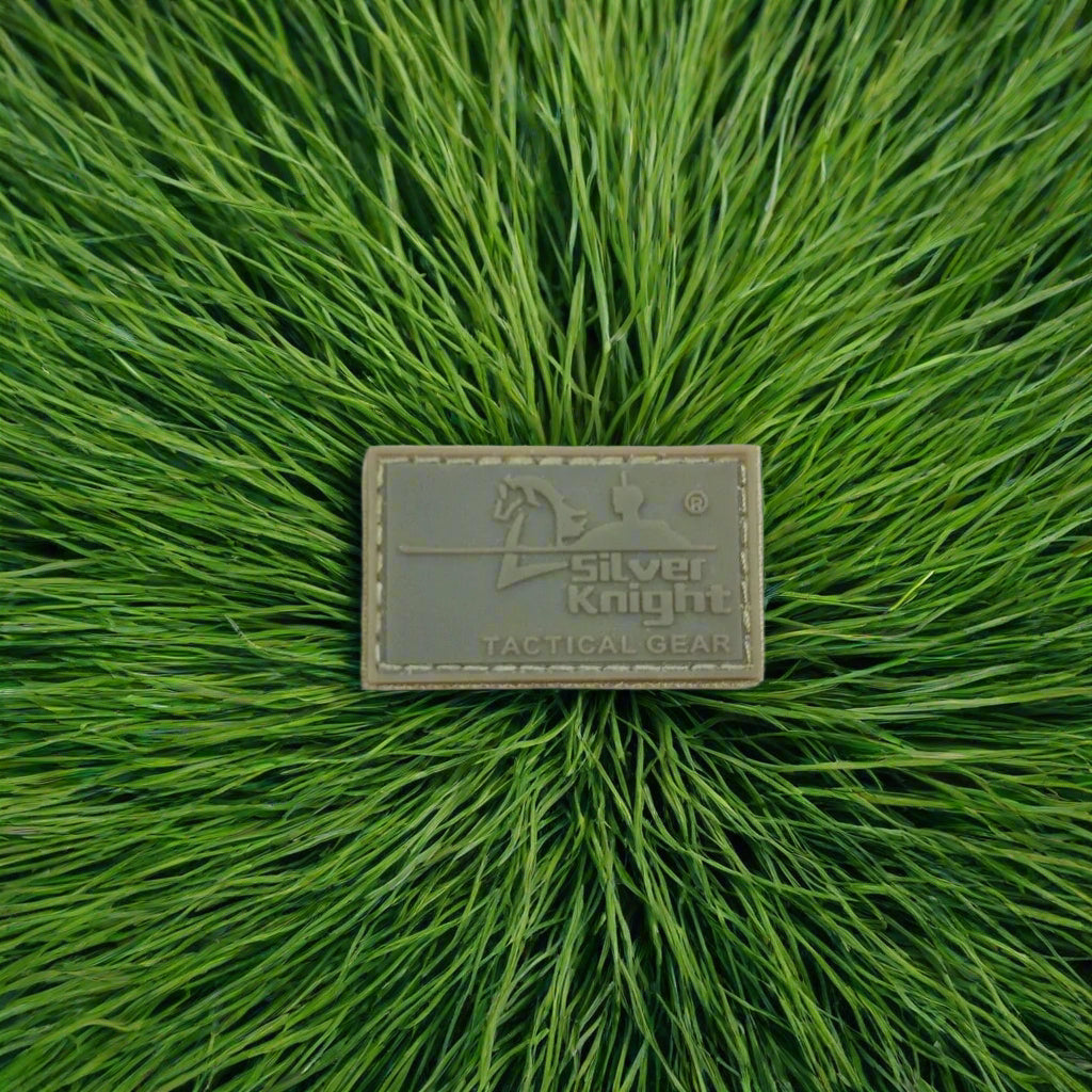 Silver Knight tactical gear patch on green grass