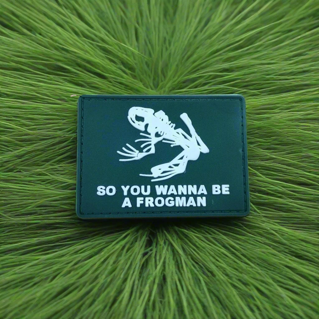 Green patch with white skeleton design and text 'SO YOU WANNA BE A FROGMAN' on a green textured background