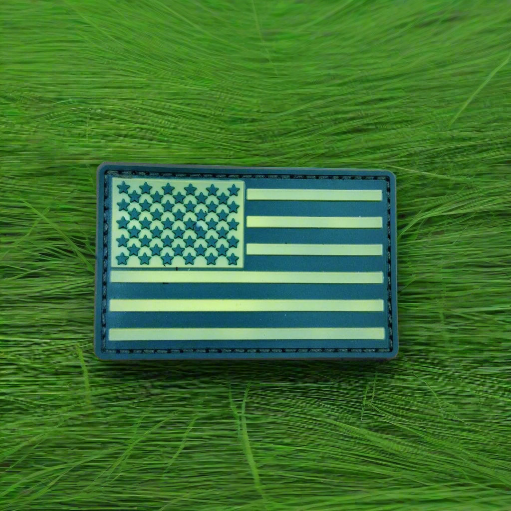 American flag patch on a green grass background