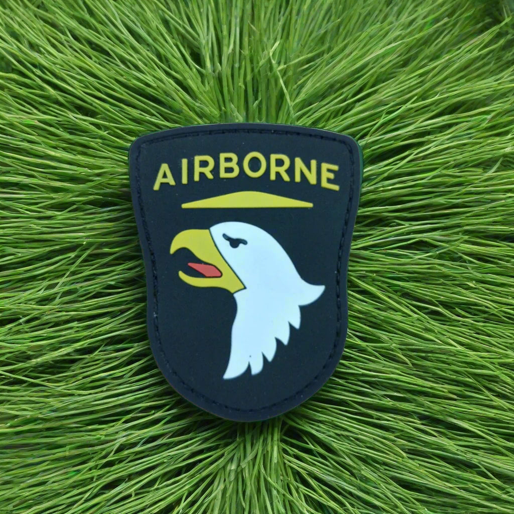 Airborne patch with an eagle design on a green grass background
