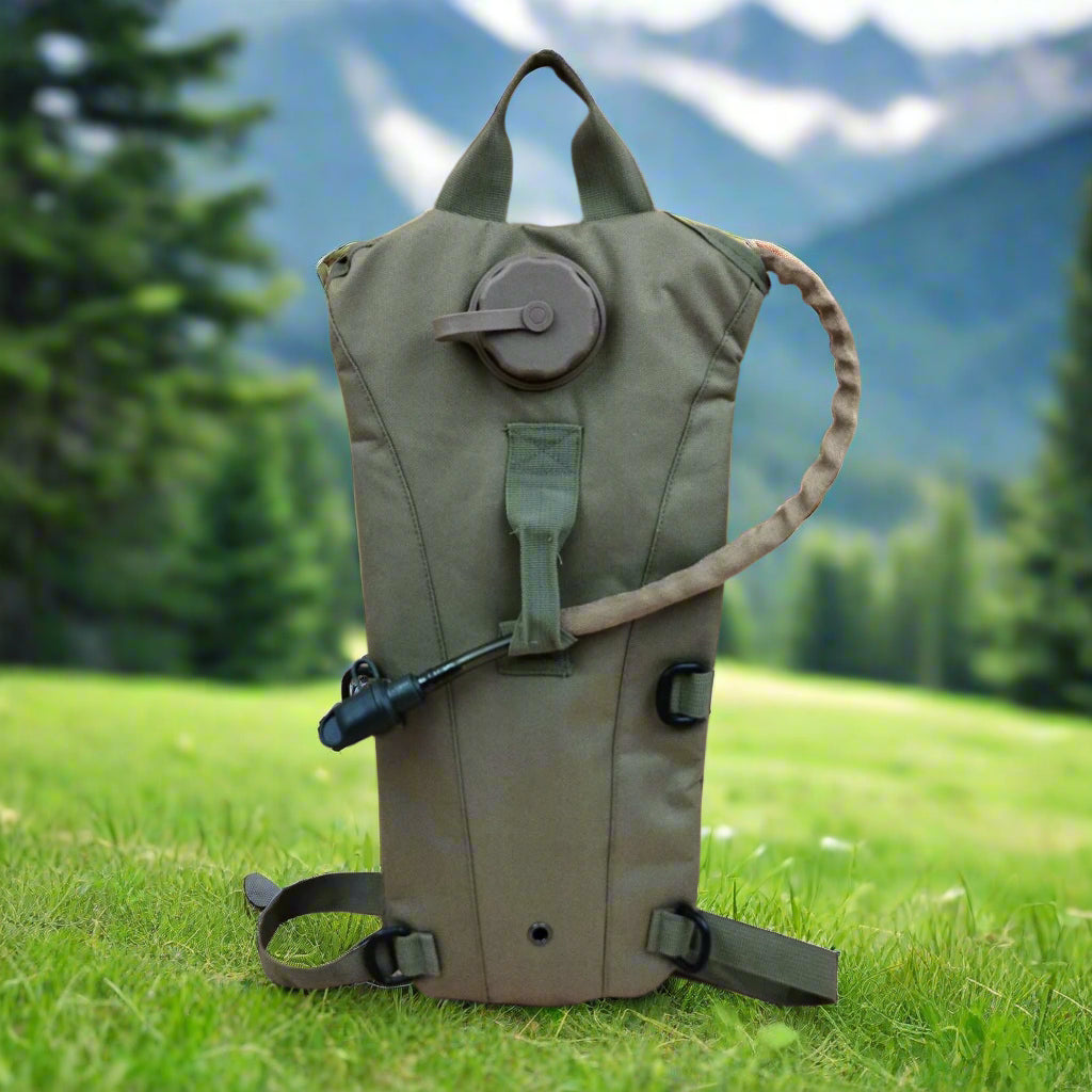 A khaki camel bag with a fitted bladder, pipe, and mouthpiece. It also features an extra flat compartment at the back for storage.