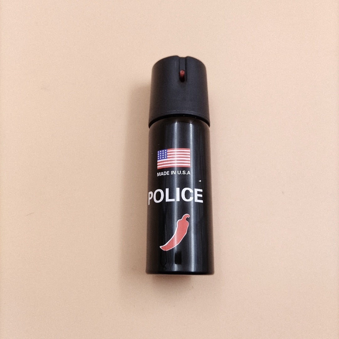 A green canister of pepper spray with a red star logo and text that includes 'NATO' and 'CS-GAS'.