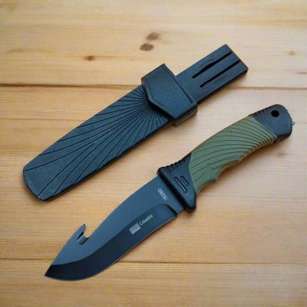 Knife with green handle and black blade on a wooden surface