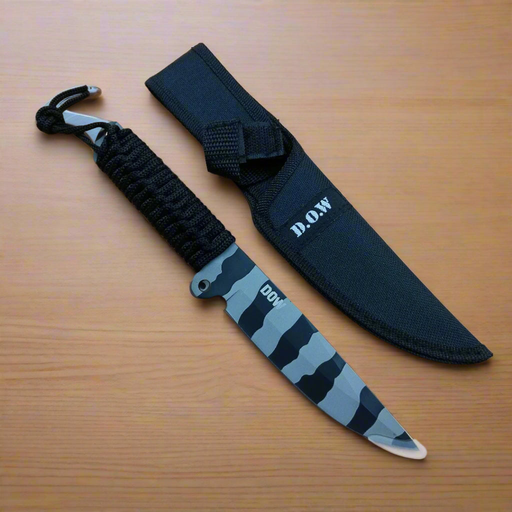 Knife with blue blade and black sheath on a beige background