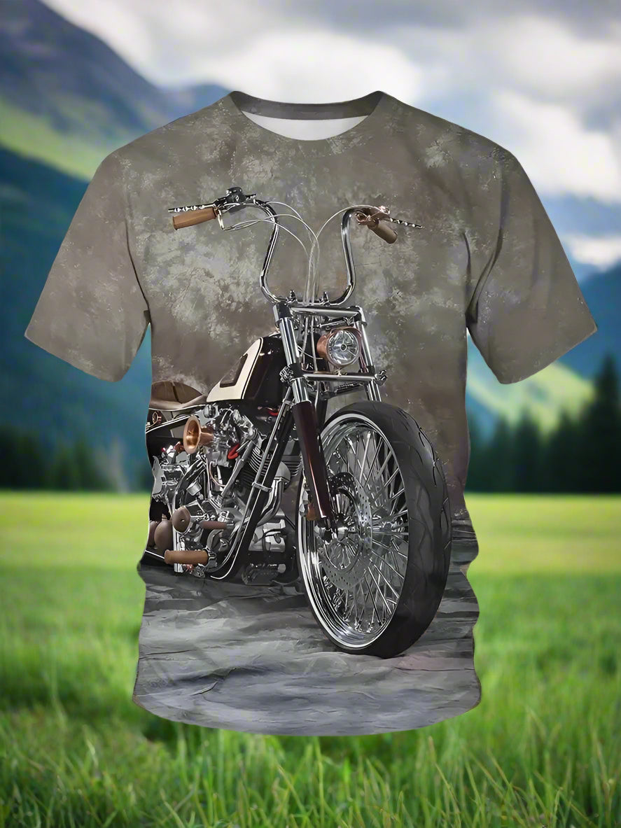 A man wearing a gray T-shirt with a graphic print of a chopper motorcycle.