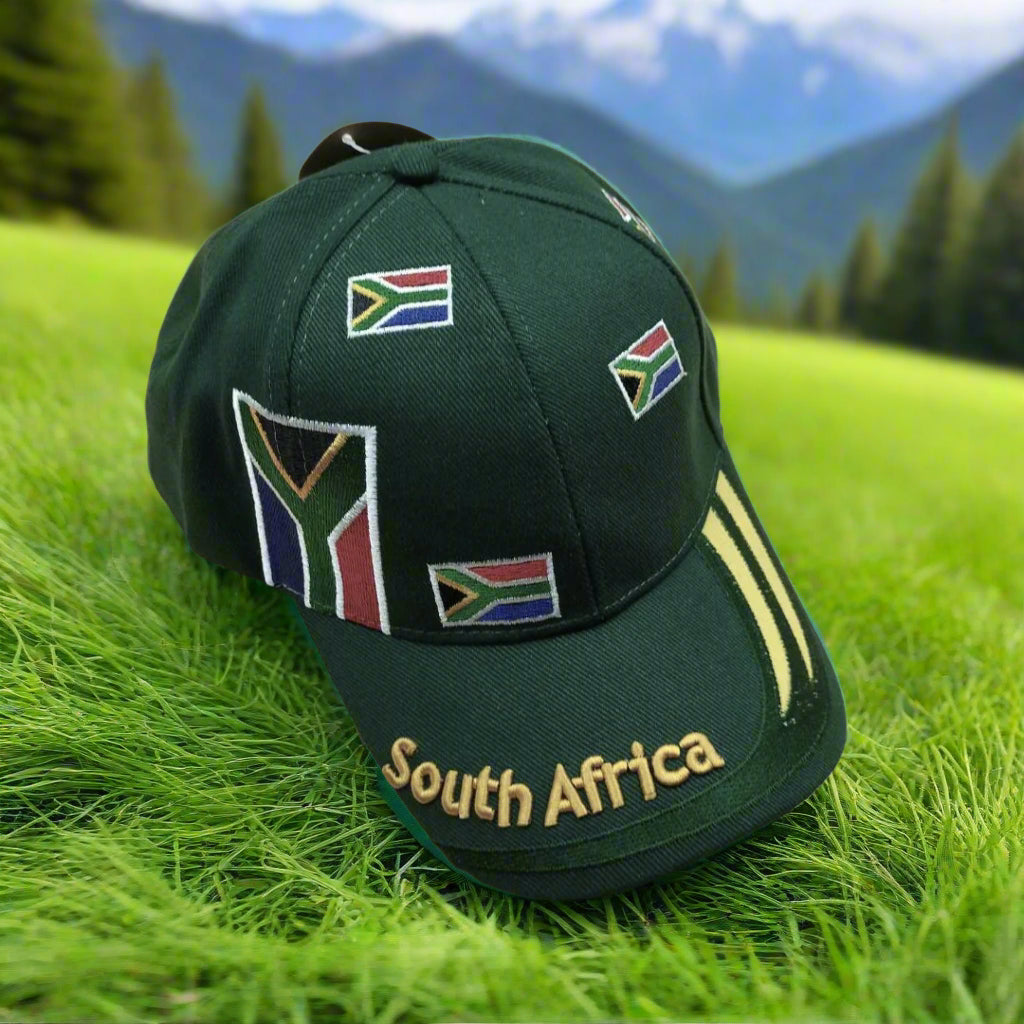 A green baseball cap with South Africa flag designs and the text 'South Africa' embroidered on it.