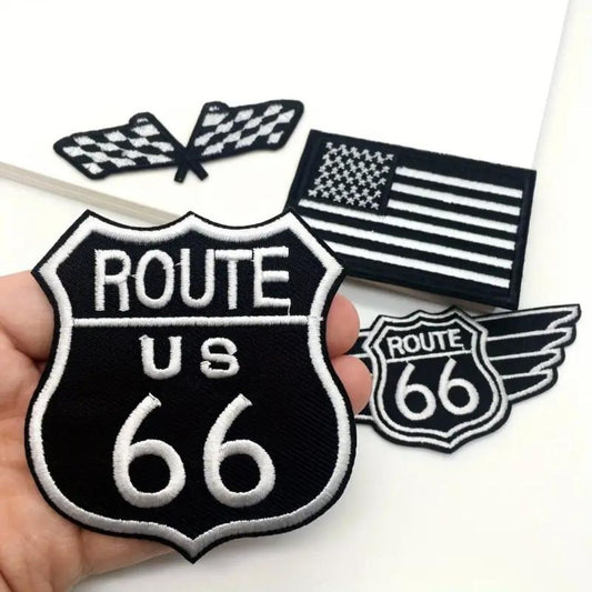 A set of four iron-on embroidery patches featuring a checkered butterfly, a US flag, and two different designs of a 'Route 66' shield.