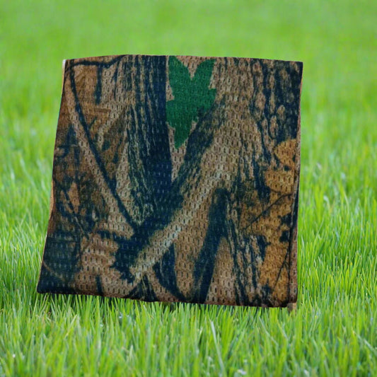 Camouflage-patterned sign on grass