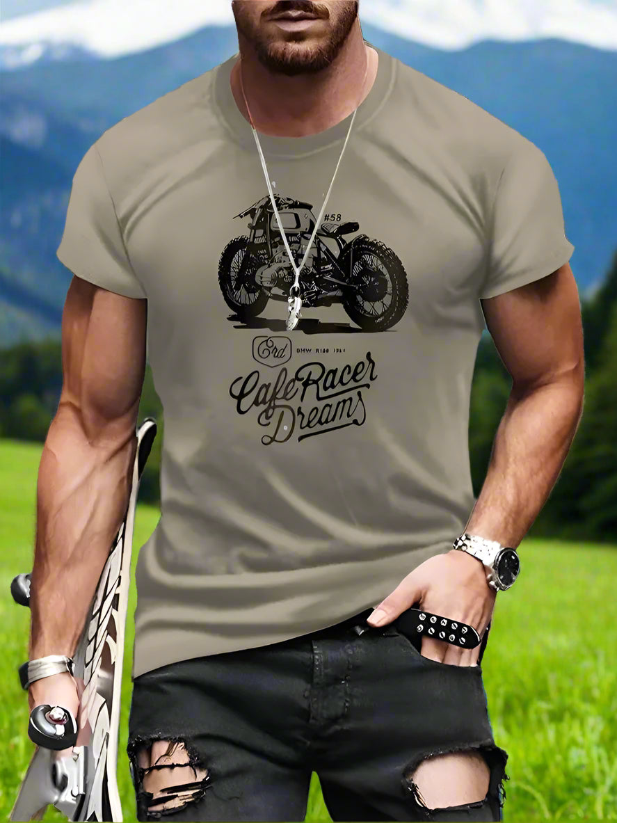 Man wearing a t-shirt with a motorcycle graphic and text on a gray background