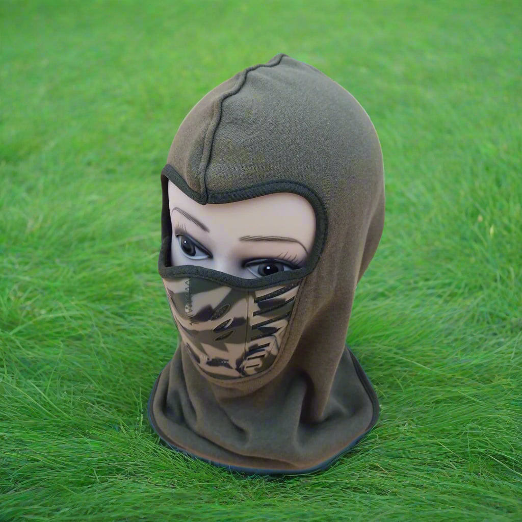 Green balaclava worn by a mannequin head on a beige background