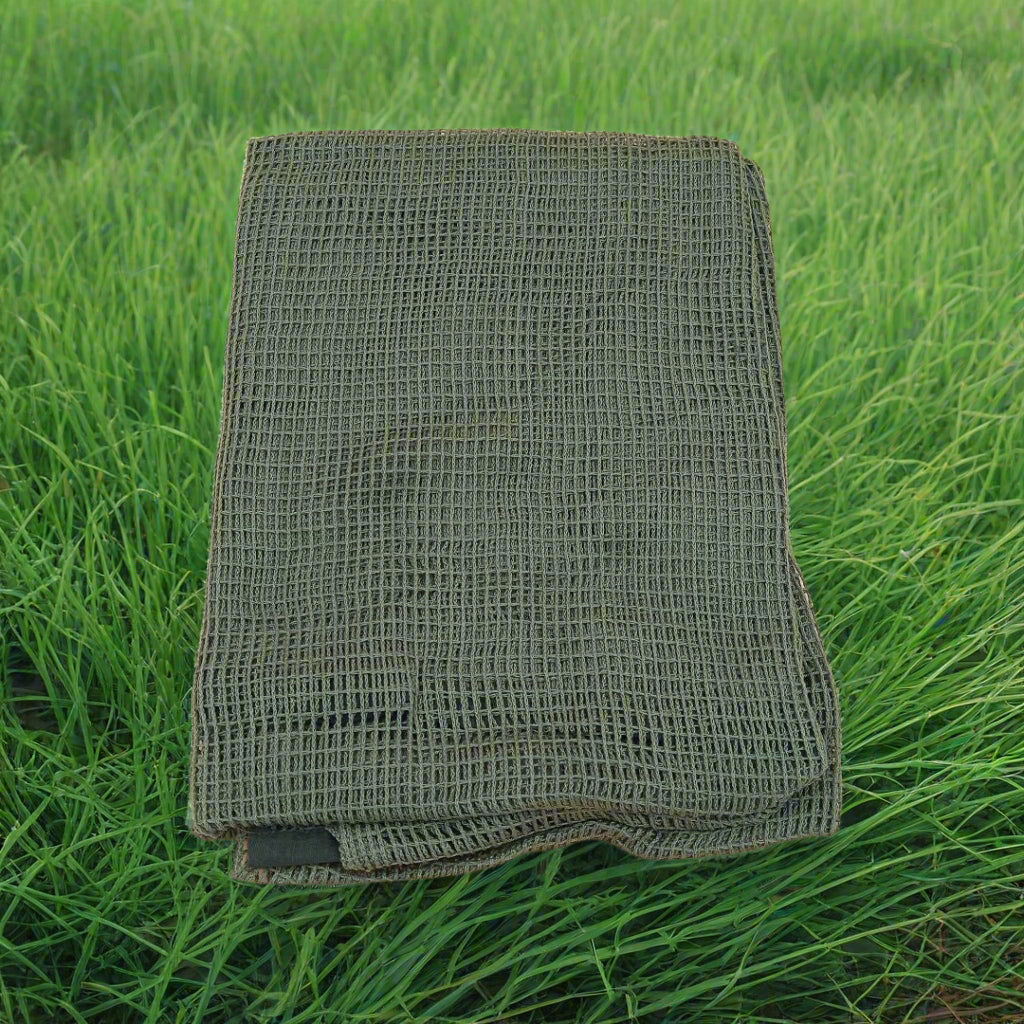 Folded green textured towel on a beige background