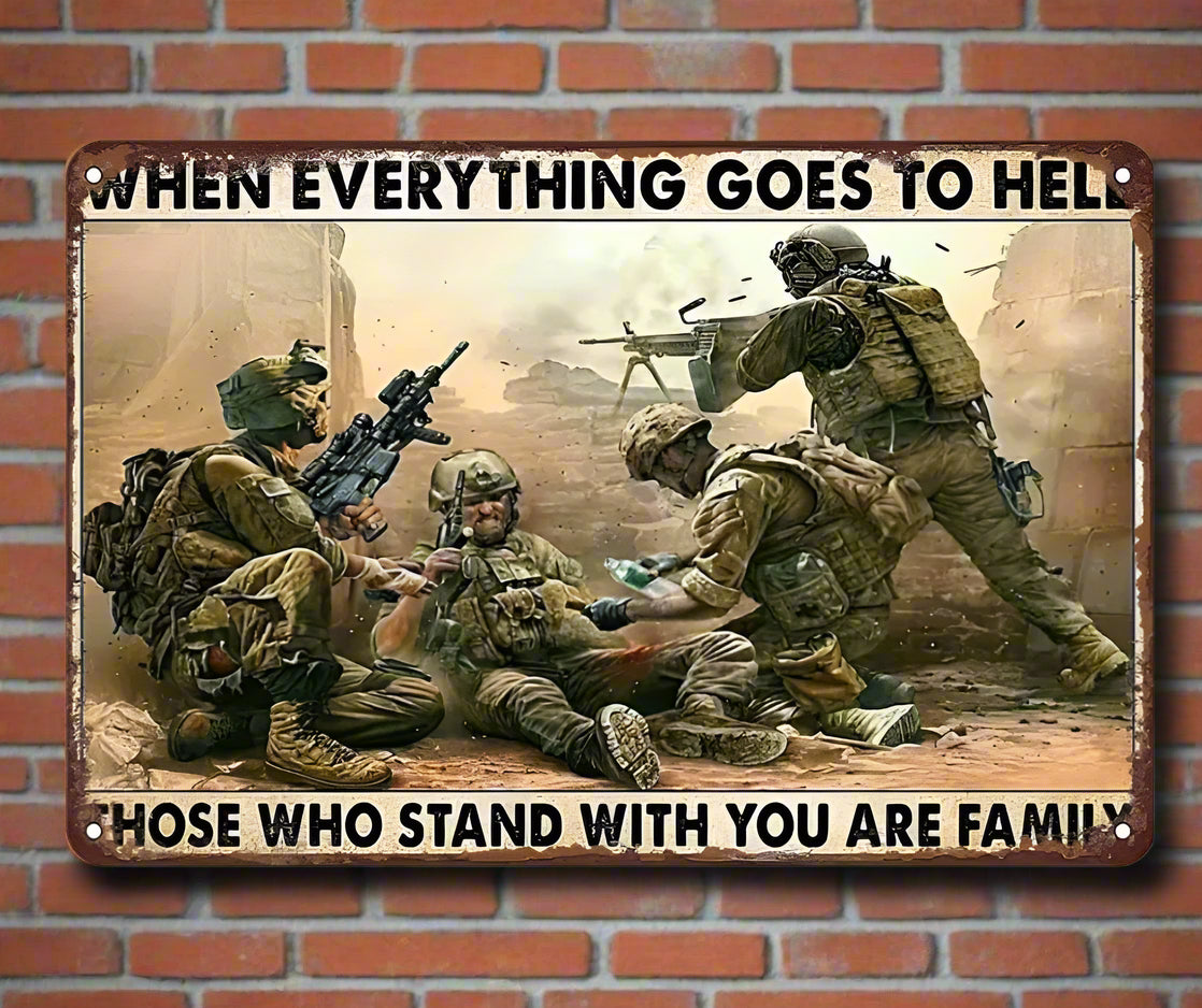 A tin sign featuring an image of soldiers fighting with the text 'WHEN EVERYTHING GOES TO HELL THOSE WHO STAND WITH YOU ARE FAMILY'.