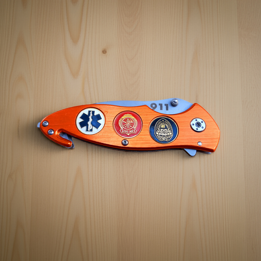 Folding knife with decorative handle on a wooden surface