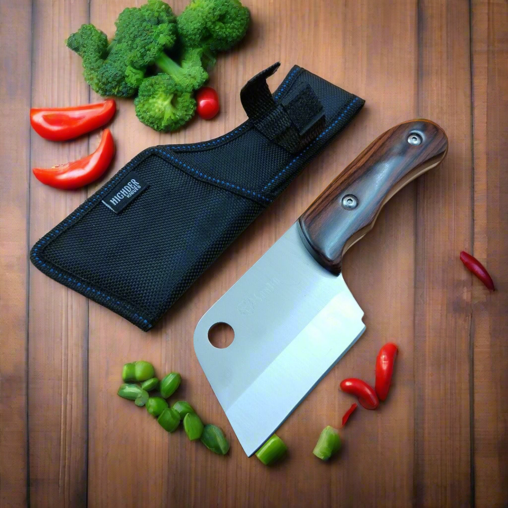 Meat cleaver with sheath on a wooden surface with vegetables