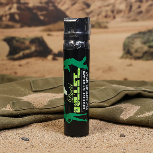 Black self-defense spray canister with green and white text on a white background liquid bullet