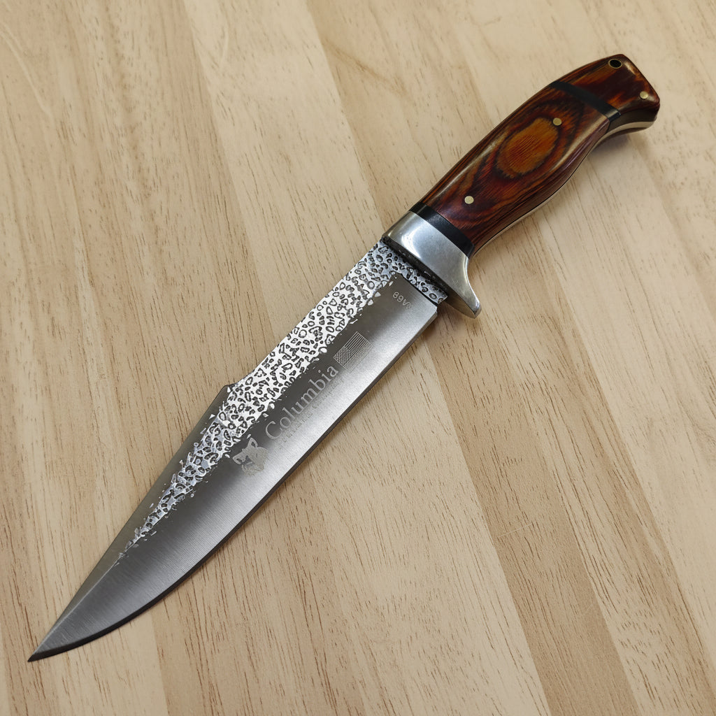Decorative knife with a wooden handle on a white background