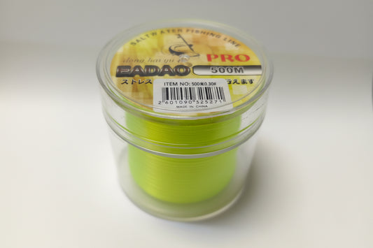 Green fishing line spool in a clear container with 'Badao' branding on a white background