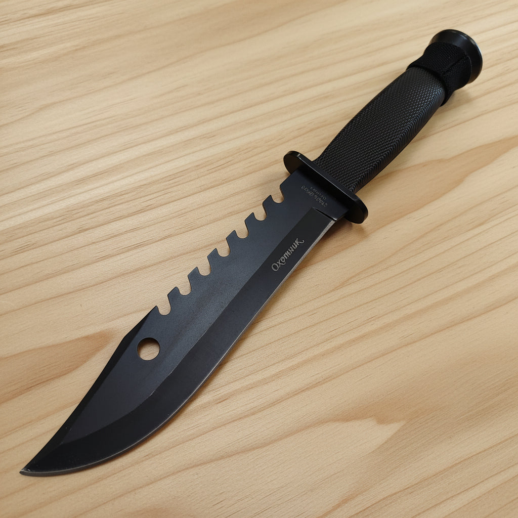 Black knife with a textured handle on a white background