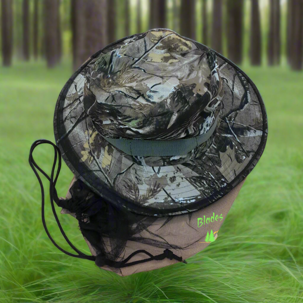 A mannequin head wearing a camouflage hat with a mosquito net attached to it.