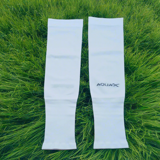 A pair of white UV protection arm sleeves laid out flat with the brand name 'AOUAX' visible on the lower part of the sleeve.