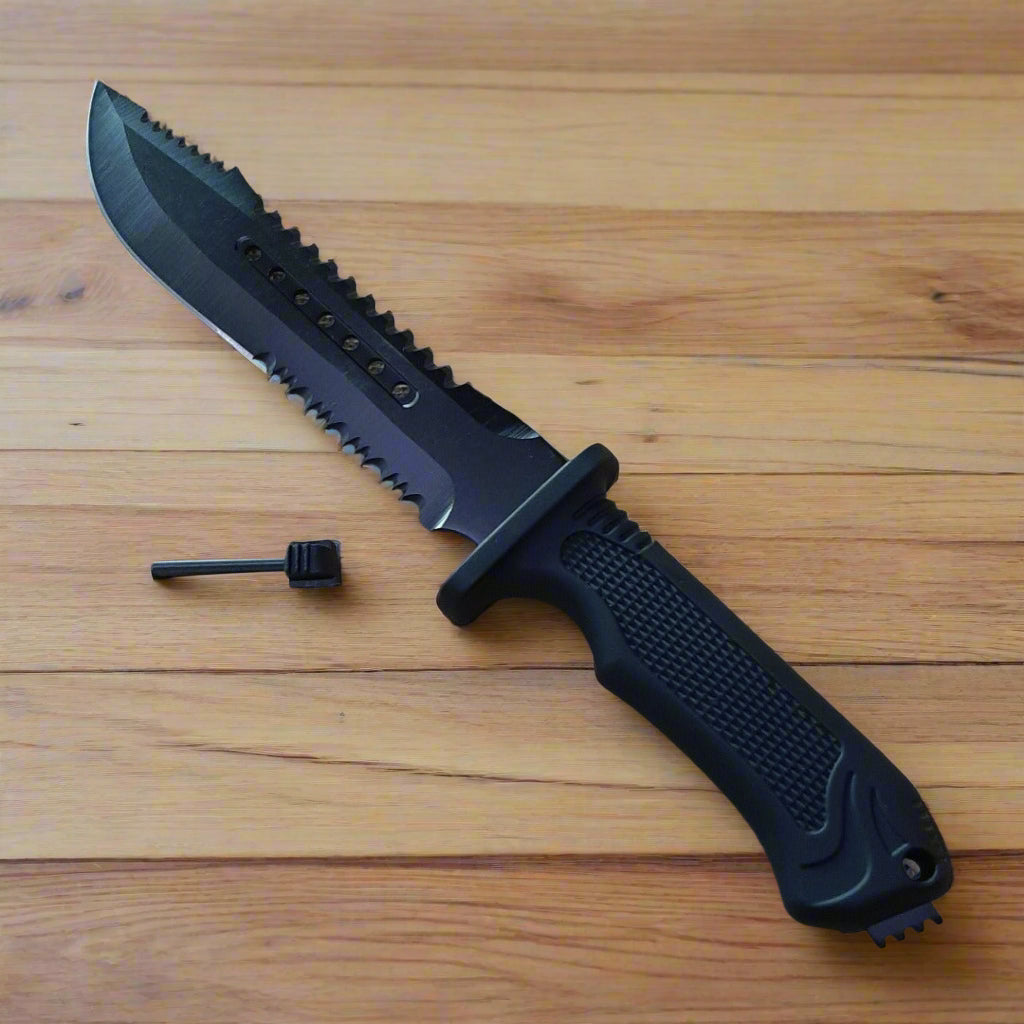 Black tactical knife with a serrated blade on a wooden surface