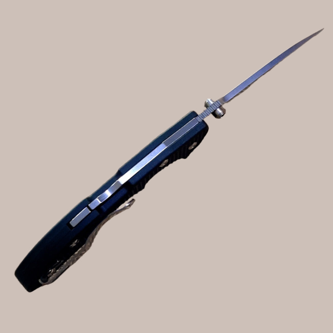 A black Boker Plus folder knife with a satin finish and a textured handle.