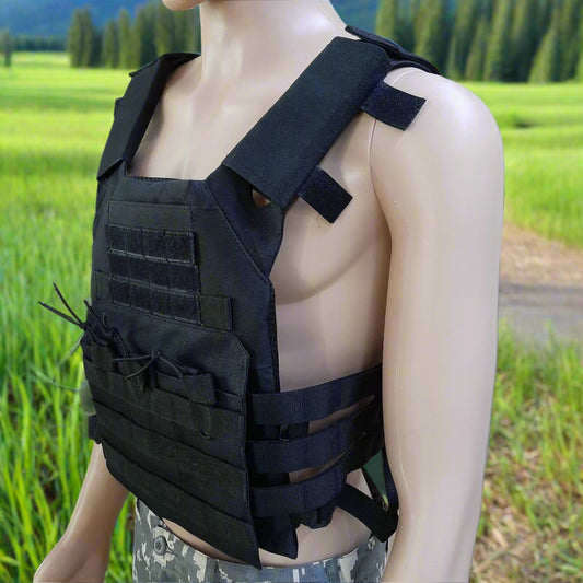 Black tactical vest on a mannequin against a natural background