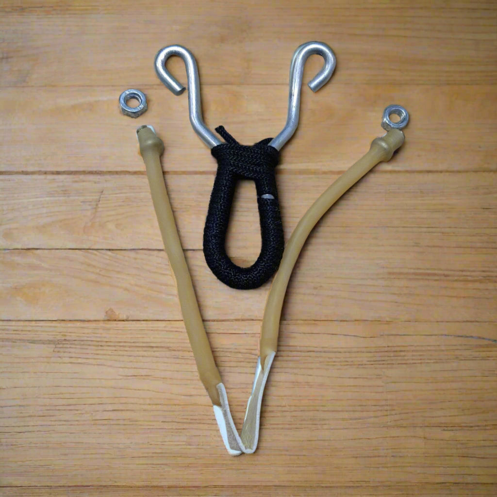 A slingshot with a metal frame and a black grip
