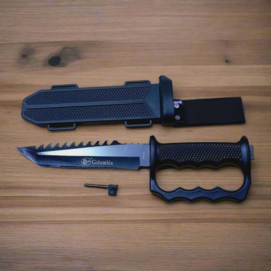 Black hunting knife with sheath on a textured surface