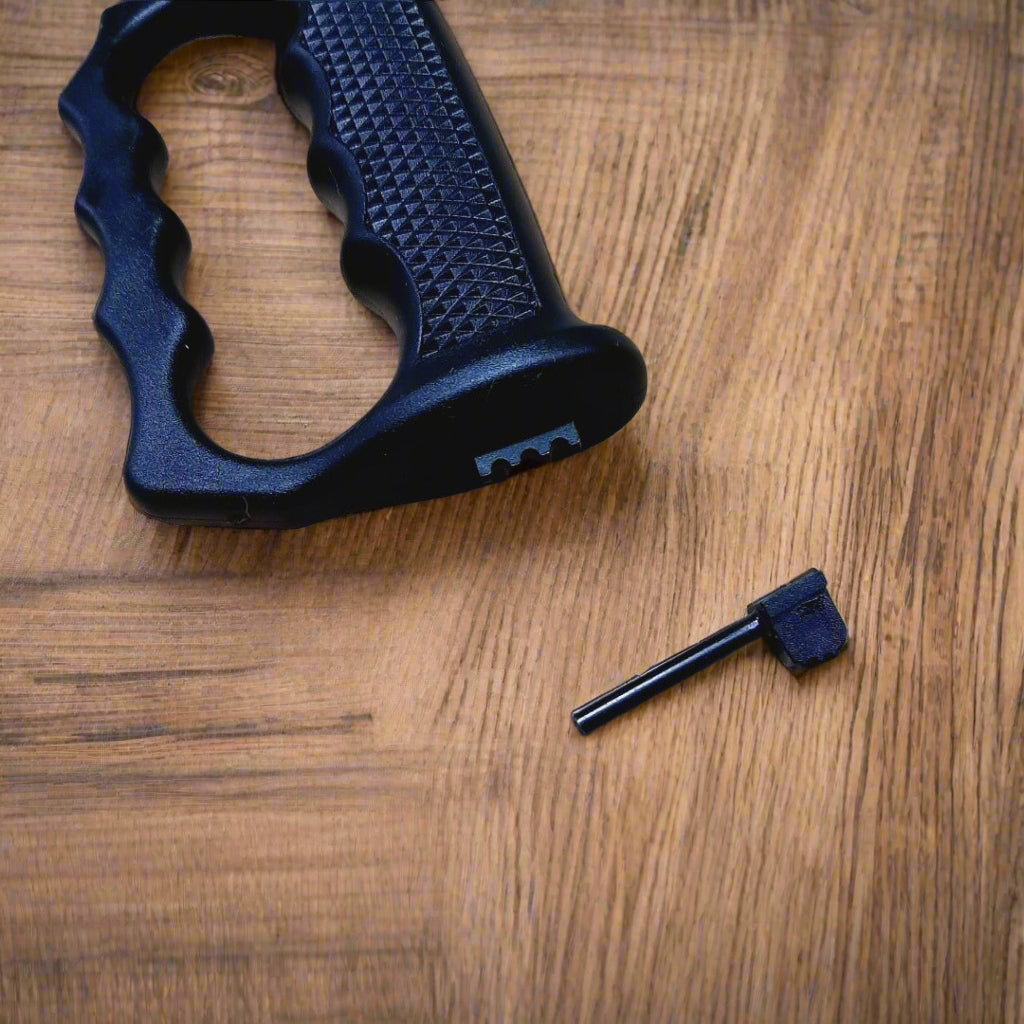 Black hunting knife with sheath on a textured surface