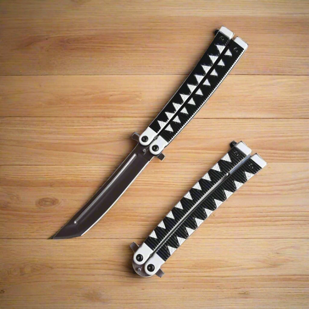 Folding knife with black and white patterned sheath on a wooden surface