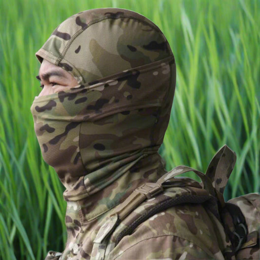 A person wearing a camouflage patterned full face mask covering.