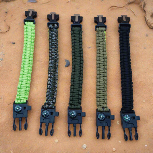 Five paracord bracelets with black clasps on a beige background