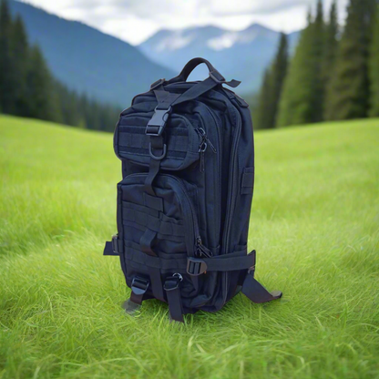 Black tactical backpack on a forest floor with fallen leaves
