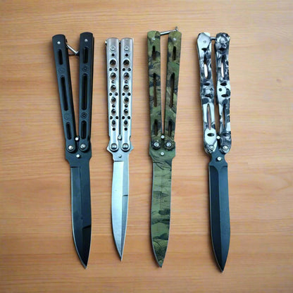 A set of four folding butterfly knives with different handle designs, including solid black, camouflage, and patterned variations.