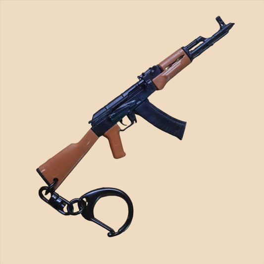Miniature firearm-style keyring with movable parts, product photograph