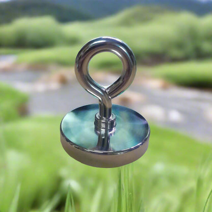 A round fishing magnet with a metallic finish and a looped rope attached to it.