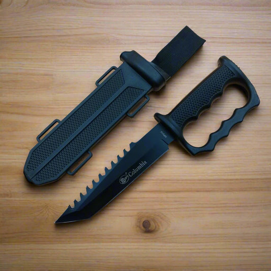 A black Columbia tactical knife with a sheath and a built-in fire starter attached.
