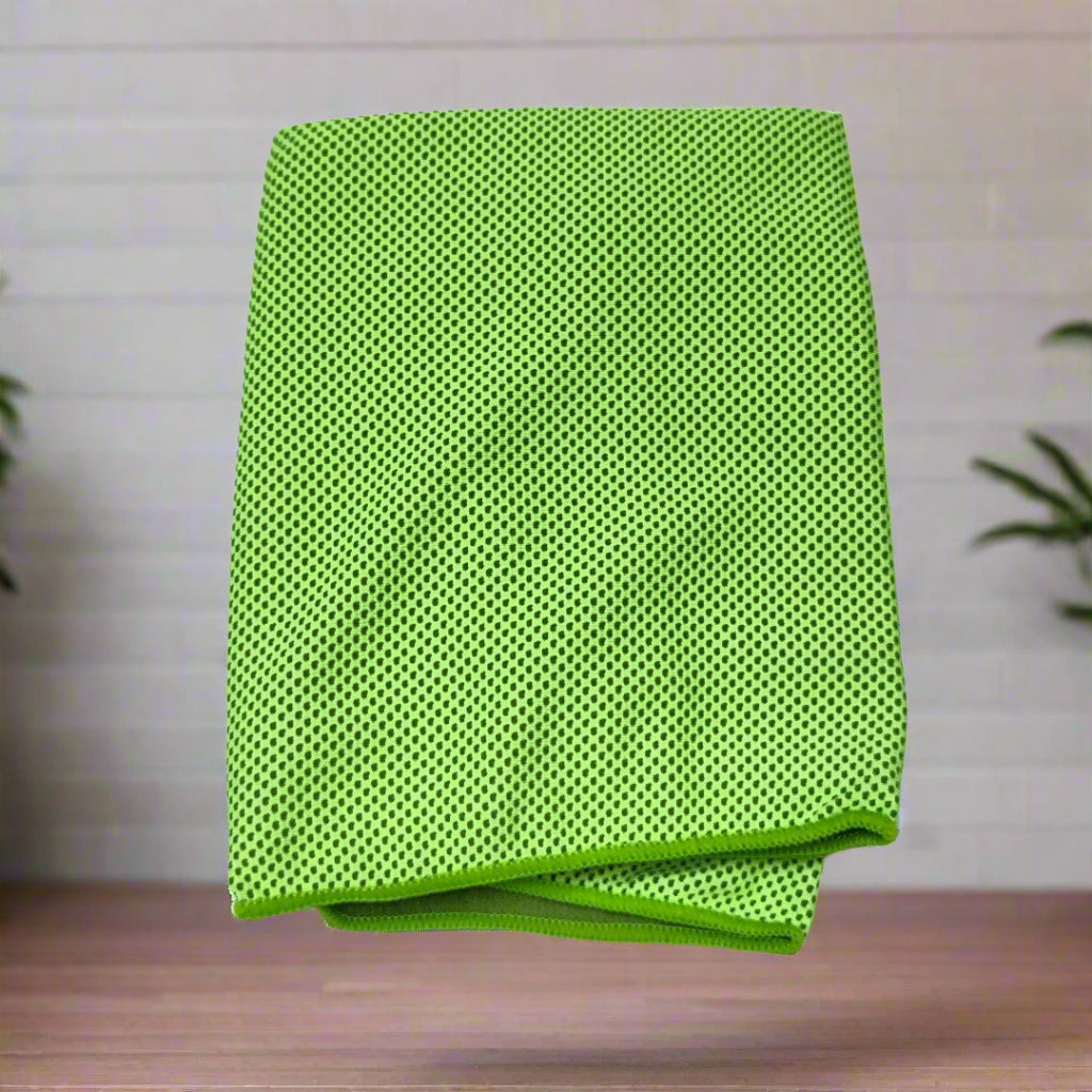 Green towel cloth on a wooden surface with a light background