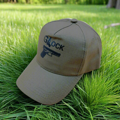 Beige cap with 'Glock' logo on grass