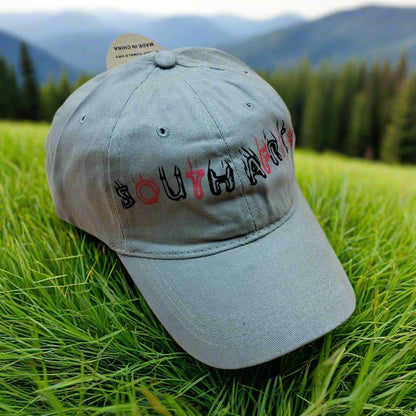 Khaki cap with 'South Africa' text on a beige background