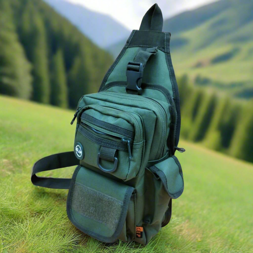 A green crossover bag with multiple compartments and zipper closures. It has adjustable straps and appears to be made of canvas material.