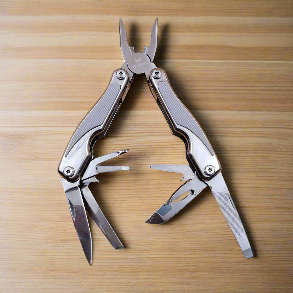 A multi-tool opened to display a knife, scissors, and other tools
