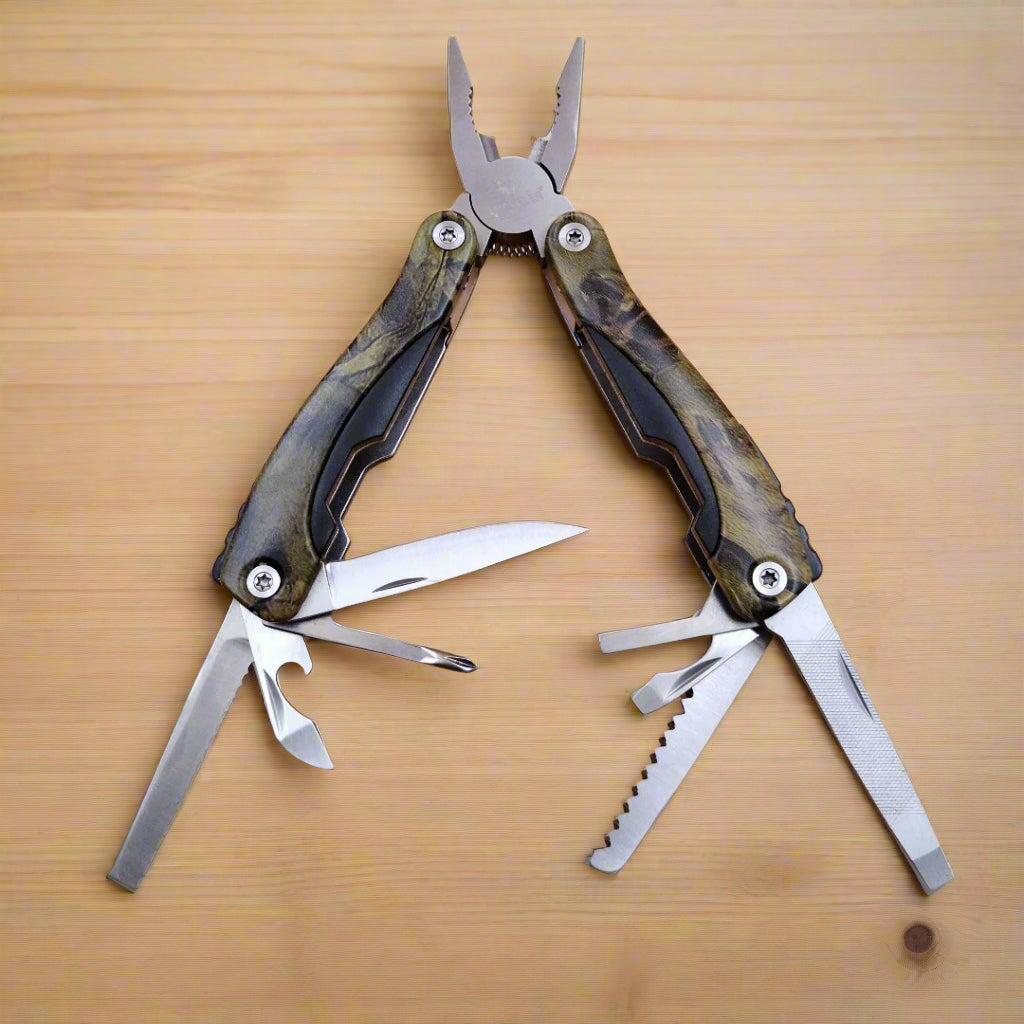 A multi-tool opened to display a knife, scissors, and other tools