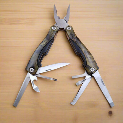 A multi-tool opened to display a knife, scissors, and other tools