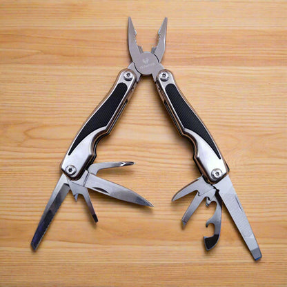 A multi-tool opened to display a knife, scissors, and other tools
