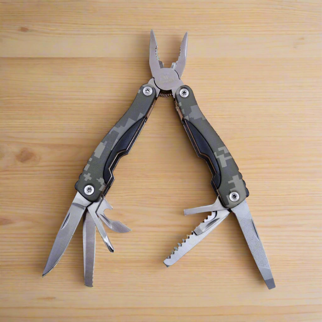 A multi-tool opened to display a knife, scissors, and other tools